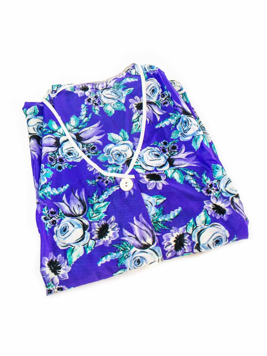 Folded smock apron in Dederon blue with floral pattern