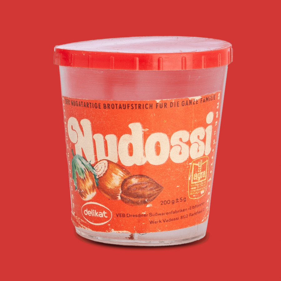 Nudossi bread spread, empty package on red background