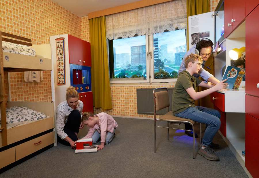 A family in the children's room at the DDR Museum