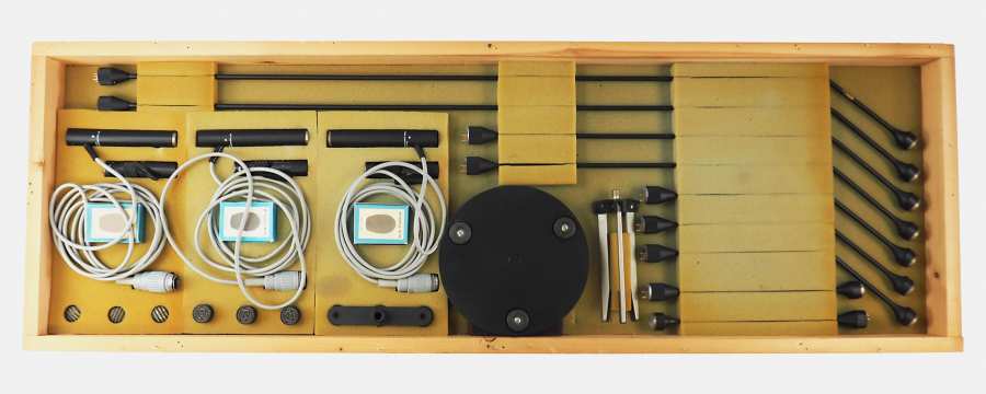 Opened wooden box with the 8 microphones + accessories
